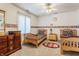 bedroom with twin beds, ceiling fan, and dresser at 14030 Old Mill Ct, Carmel, IN 46032