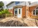 Wide angle view of home's deck, with brick and siding exterior and a bay window at 14030 Old Mill Ct, Carmel, IN 46032