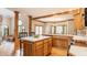 Well-lit kitchen with hardwood floors, a center island, and a connected dining area at 14030 Old Mill Ct, Carmel, IN 46032