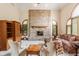 Spacious living room featuring a brick fireplace, large windows, and neutral-toned decor at 14030 Old Mill Ct, Carmel, IN 46032