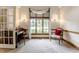 Cozy office featuring natural light through large window, complemented by stylish furnishings at 14030 Old Mill Ct, Carmel, IN 46032