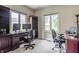 Home office with two work spaces, built-in bookshelves and natural lighting at 14030 Old Mill Ct, Carmel, IN 46032