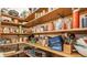 Walk-in pantry with fully stocked shelves and various appliances at 14030 Old Mill Ct, Carmel, IN 46032