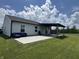 The house has a concrete patio with seating and a covered pergola to enjoy the backyard views at 1406 Bigleaf Cir, Sheridan, IN 46069