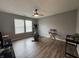 This room features wood floors, two bright windows, a ceiling fan, and space for work and exercise at 1406 Bigleaf Cir, Sheridan, IN 46069