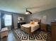 Relaxing main bedroom with hardwood floors, a ceiling fan, and natural light at 1406 Bigleaf Cir, Sheridan, IN 46069