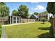 The serene backyard with garden shed, storage shed, and lush landscaping at 1406 Linden St, Indianapolis, IN 46203