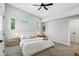 Bright and airy bedroom featuring vaulted ceilings, a ceiling fan, and ensuite bathroom at 1406 Linden St, Indianapolis, IN 46203