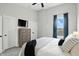 Bedroom with large window, TV, and ensuite closet at 1406 Linden St, Indianapolis, IN 46203