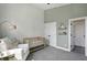 Bright Bedroom area with accent wall, crib, chair and ample space at 1406 Linden St, Indianapolis, IN 46203
