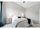 Well-lit bedroom with large windows, ceiling fan, and soft carpet at 1406 Linden St, Indianapolis, IN 46203