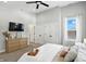 Spacious bedroom featuring a ceiling fan, a window, a dresser, and ample closet space at 1406 Linden St, Indianapolis, IN 46203