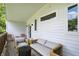 Covered back deck featuring outdoor seating, and access to the inside at 1406 Linden St, Indianapolis, IN 46203
