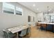 Dining room features an exposed view of the kitchen with an open concept feel and lots of light at 1406 Linden St, Indianapolis, IN 46203