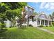 Beautiful front yard with healthy grass, a modern home exterior, and lovely neighborhood setting at 1406 Linden St, Indianapolis, IN 46203
