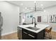 Bright kitchen includes stainless appliances, island seating, and is ready for culinary adventures at 1406 Linden St, Indianapolis, IN 46203