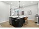 Modern kitchen island featuring sleek countertops, a stylish faucet, and comfortable seating at 1406 Linden St, Indianapolis, IN 46203