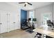 Well-lit office space with exercise equipment and functional workspace at 1406 Linden St, Indianapolis, IN 46203