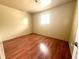 Cozy bedroom with natural light and laminate flooring at 1509 S Rural St, Indianapolis, IN 46203
