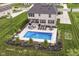 Amazing backyard pool featuring a basketball hoop, an outdoor lounge area, and beautiful landscaping at 16283 Spring Bank Ct, Fishers, IN 46040