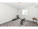 Basement gym with neutral carpet, work-out bench, free weights, and a window for natural light at 16283 Spring Bank Ct, Fishers, IN 46040