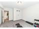 Basement bedroom with neutral carpet, double closet doors, and a doorway to an adjacent space at 16283 Spring Bank Ct, Fishers, IN 46040