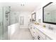 This bright bathroom features double sinks, granite countertops, and a walk-in shower at 16283 Spring Bank Ct, Fishers, IN 46040