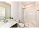 Bathroom with granite vanity, a toilet, and a shower with black and white shower curtain at 16283 Spring Bank Ct, Fishers, IN 46040