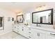 Bright bathroom with double sinks, granite countertops, and sleek fixtures at 16283 Spring Bank Ct, Fishers, IN 46040