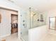 Modern bathroom featuring a frameless glass shower with white tile and a walk-in closet at 16283 Spring Bank Ct, Fishers, IN 46040