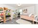 Bright bedroom with a bed, a workspace, shelves, and a fluffy rug, perfect for a young occupant at 16283 Spring Bank Ct, Fishers, IN 46040