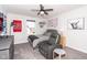 Cozy bedroom with a ceiling fan, a comfortable chair, and personal touches for a relaxed atmosphere at 16283 Spring Bank Ct, Fishers, IN 46040