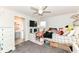 Bright bedroom with a ceiling fan, plush bedding and a dedicated workspace with a computer setup at 16283 Spring Bank Ct, Fishers, IN 46040