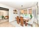 Cozy dining room with modern lighting fixture and view into the living room at 16283 Spring Bank Ct, Fishers, IN 46040