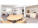 Finished basement with ping pong table, round table, and large seating area at 16283 Spring Bank Ct, Fishers, IN 46040