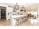 Modern kitchen with large island, white cabinetry, stainless steel appliances, and open layout to dining area at 16283 Spring Bank Ct, Fishers, IN 46040