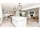Open kitchen with central island, stainless steel appliances, and seamless flow to living and dining at 16283 Spring Bank Ct, Fishers, IN 46040
