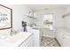 Bright laundry room with modern appliances, white cabinets, and countertop space at 16283 Spring Bank Ct, Fishers, IN 46040