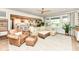 Bright living room with a large sectional couch, leather chair, stylish rug, and an open floor plan at 16283 Spring Bank Ct, Fishers, IN 46040