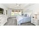 This main bedroom boasts three large windows and light-colored walls at 16283 Spring Bank Ct, Fishers, IN 46040