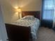 Cozy bedroom with a comfortable bed, soft lighting, and a relaxing atmosphere at 1807 Park North Bnd, Indianapolis, IN 46260