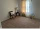 Bright bedroom features neutral walls and carpet, with lots of space for toys or furniture at 1807 Park North Bnd, Indianapolis, IN 46260