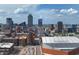 Expansive skyline view, showcasing the city's modern architecture and landmark buildings against a vibrant blue sky and cloudscape at 207 S Meridian St # 2F, Indianapolis, IN 46225