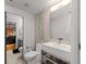 Modern bathroom featuring sleek fixtures, contemporary tile work, and open shelving, enhancing the space's stylish appeal at 207 S Meridian St # 2F, Indianapolis, IN 46225