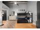 This bedroom has bunkbeds, a dresser, and hardwood floors, perfect for a ' room or guest room at 207 S Meridian St # 2F, Indianapolis, IN 46225