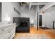 This bedroom features bunk beds, a dresser, hardwood floors and ample lighting at 207 S Meridian St # 2F, Indianapolis, IN 46225