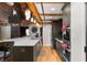 Modern kitchen with stainless steel appliances, white countertops, and dark cabinets at 207 S Meridian St # 2F, Indianapolis, IN 46225