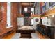 Spacious kitchen with stainless steel appliances, pendant lighting, and pool table at 207 S Meridian St # 2F, Indianapolis, IN 46225