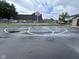 Community basketball court near a pool and seating, perfect for outdoor recreation at 2080 Miracle Dr, Columbus, IN 47201