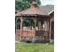 Charming backyard gazebo featuring a swing, decorative accents, and a well-maintained lawn at 2080 Miracle Dr, Columbus, IN 47201
